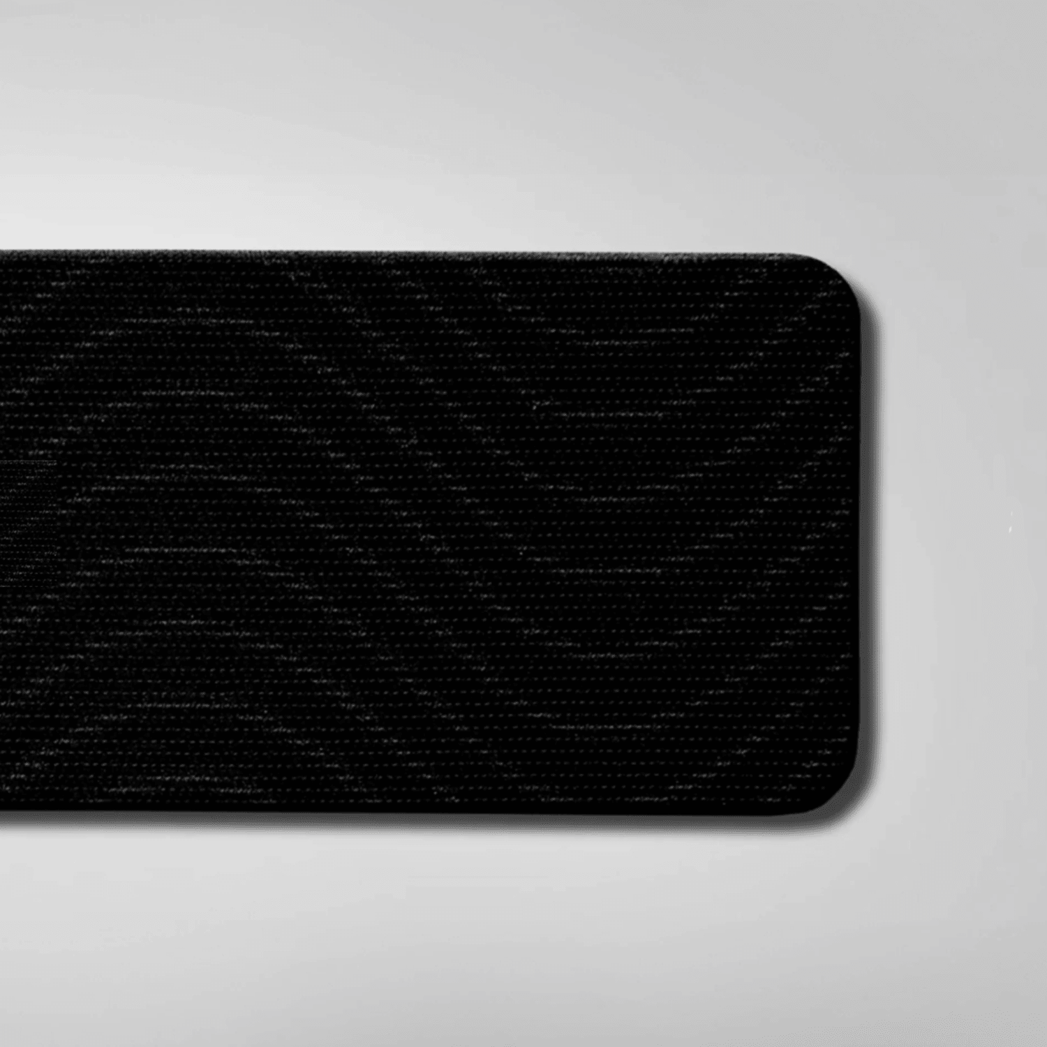 Black textured mouth tape on a gray background