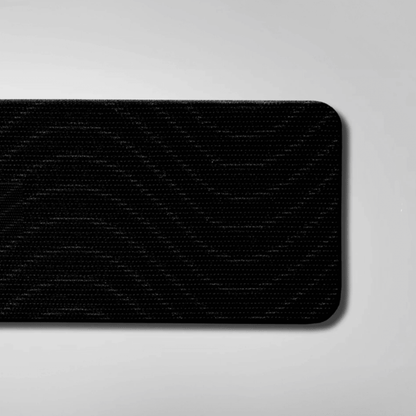Black textured mouth tape on a gray background